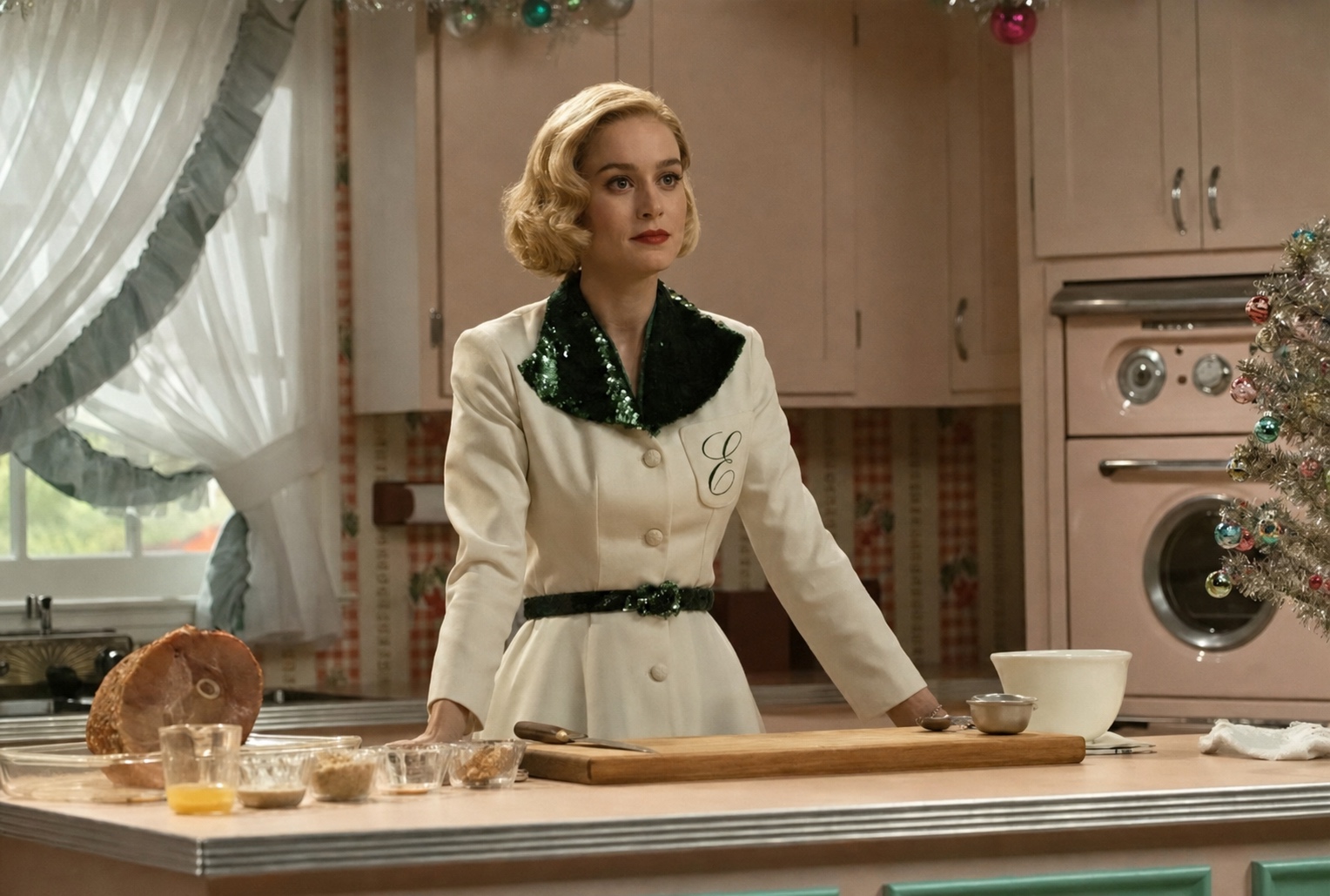 Brie Larson in a belted 1950s dress in a pastel kitchen, Lessons in Chemistry